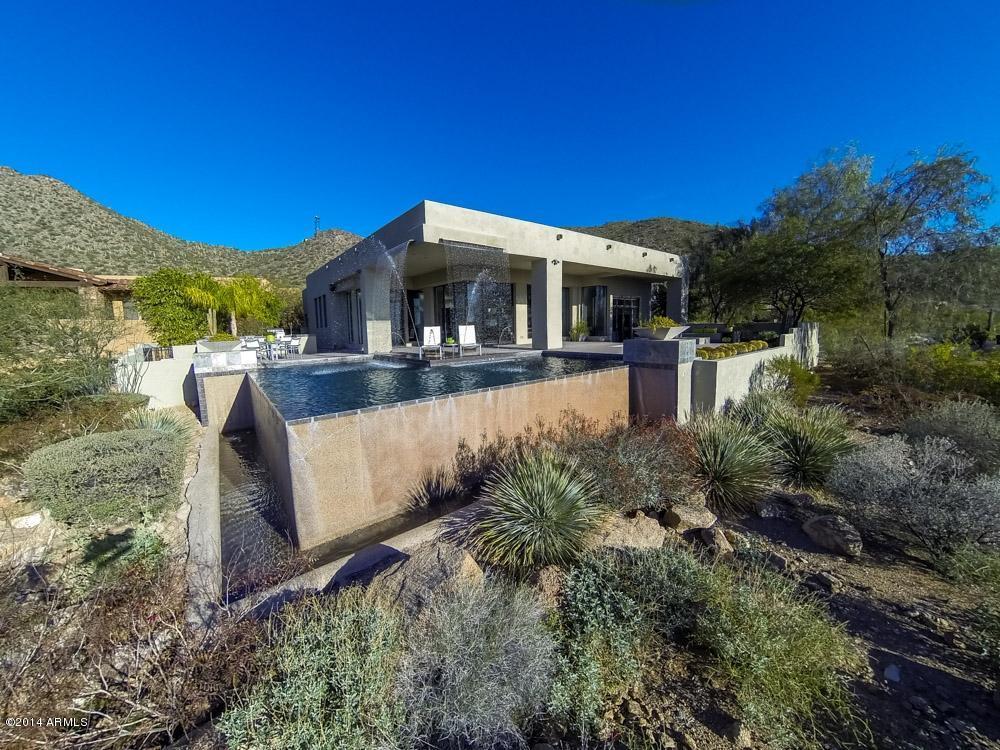 This Negative Edge Pool with Cascading Water Falling from the Roof sets this Contemporary in LAS SENDAS MOUNTAIN apart from the&nbsp;rest!